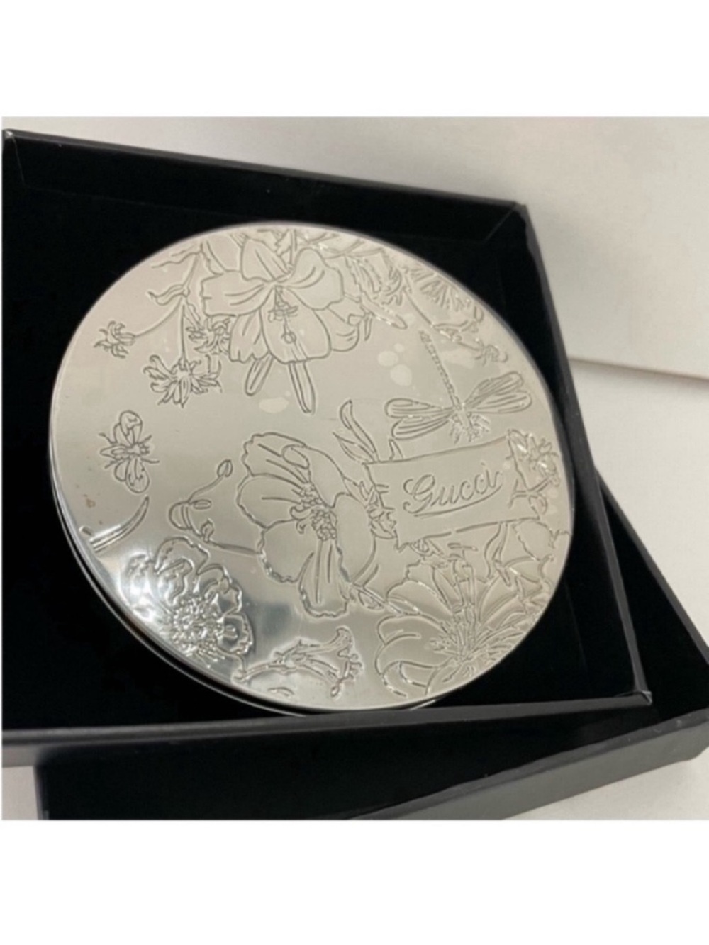Dior gift holding fan